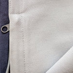 Close-up of fabric texture with a zipper pull
