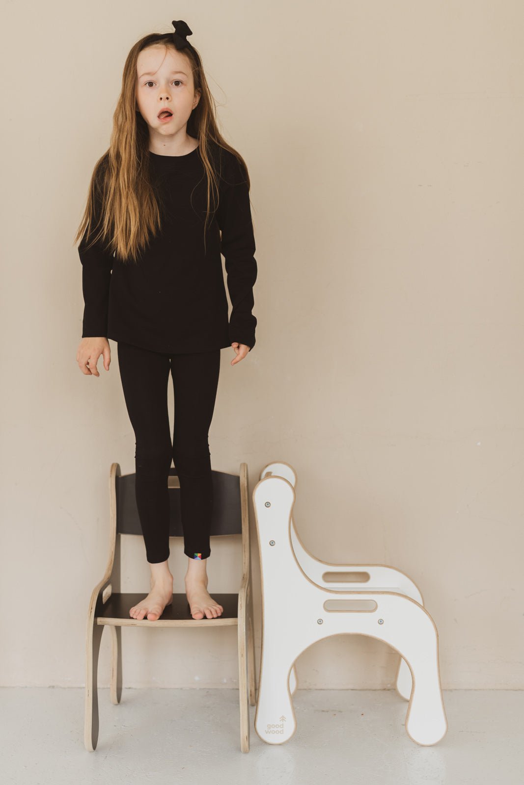 GIRLS PLAYING ON GOOD WOOD CHAIRS IN WHITE AND BLACK