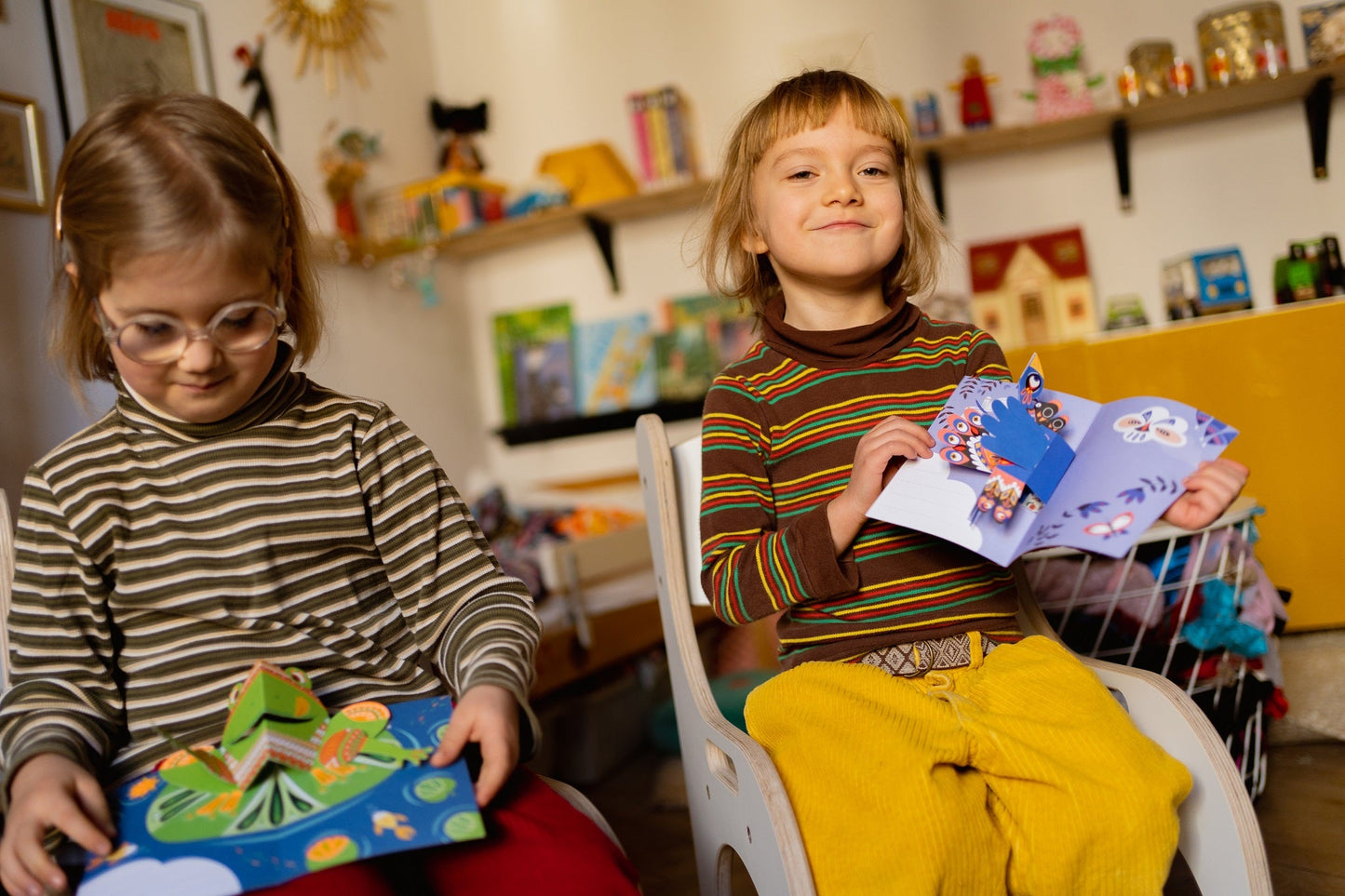 CHILDREN SITTING ON GOOD WOOD CHAIRS 