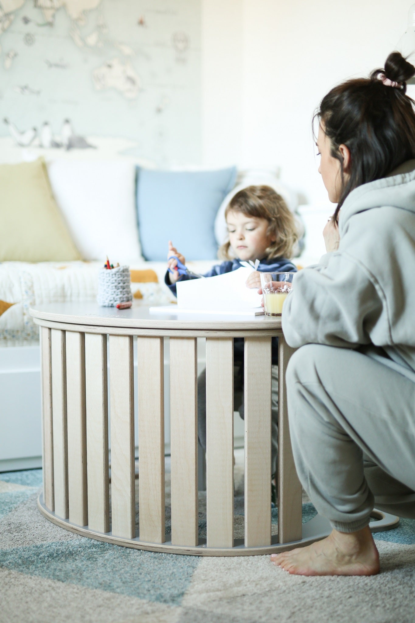 small girl drawing a picture on the tabletop rocker