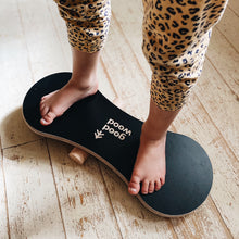 Load image into Gallery viewer, A GIRL BALANCING ON THE BLACK BALANCE BOARD / TRICK BOARD FOR KIDS- GOOD WOOD