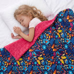 a girl sleeping under summer meadow weighted blanket